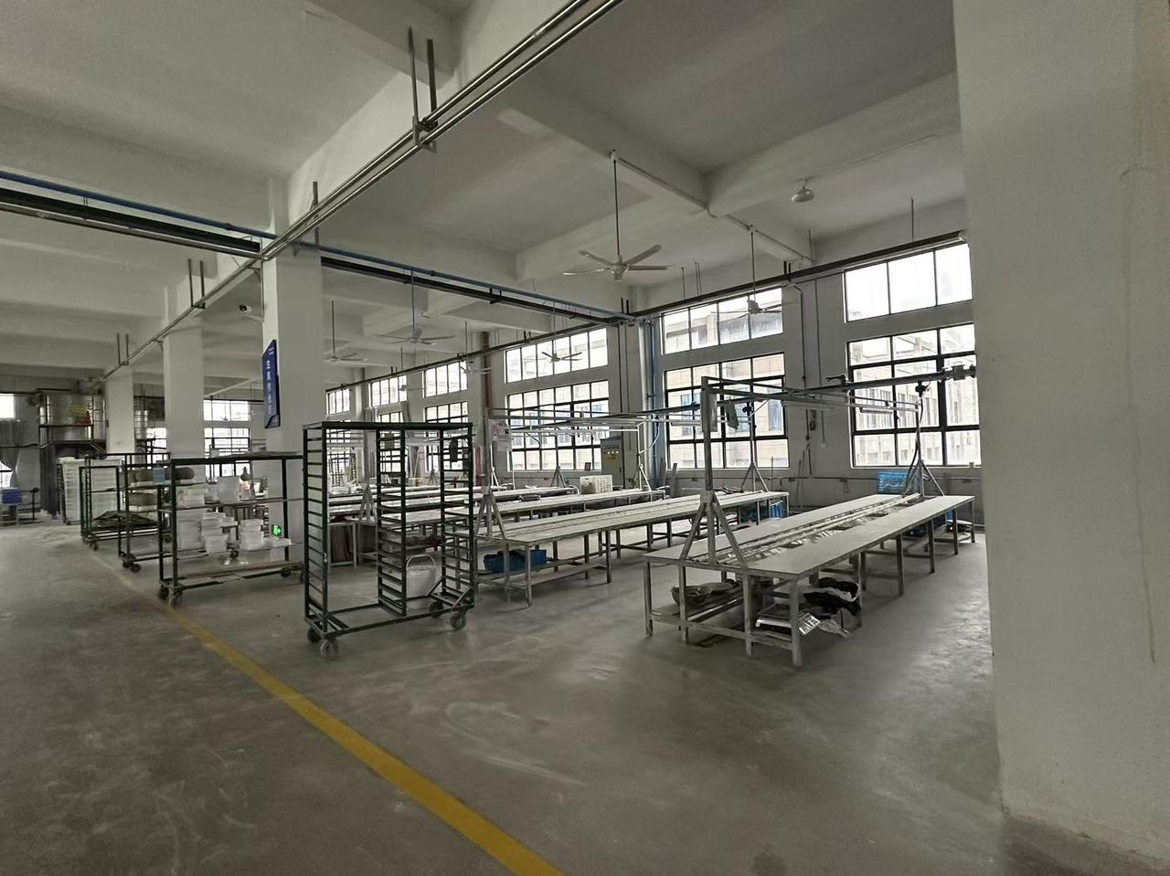 FUFORPETS factory production area with long worktables and natural light